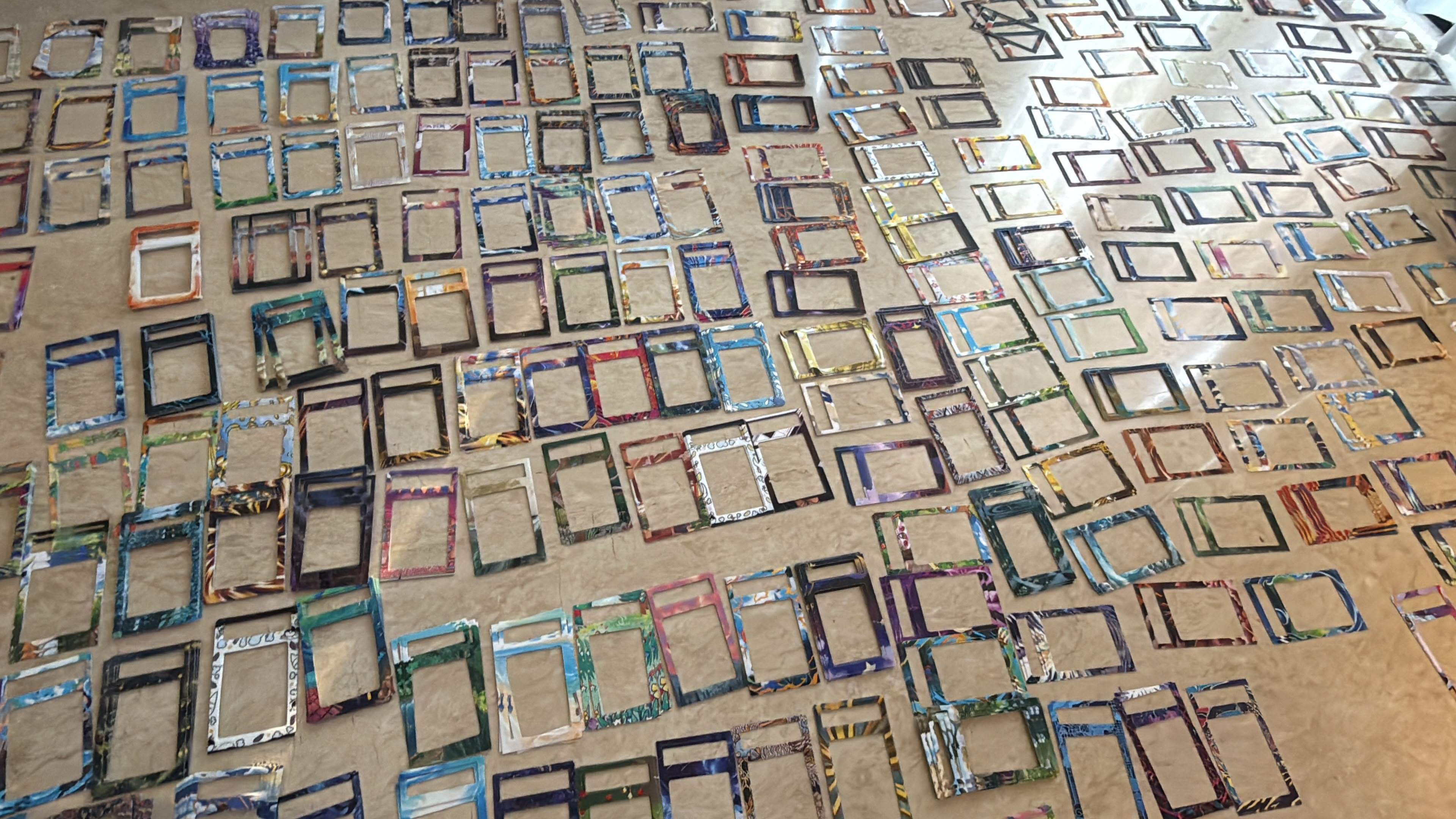 Close-up of an illustrator extending card artwork stroke by stroke