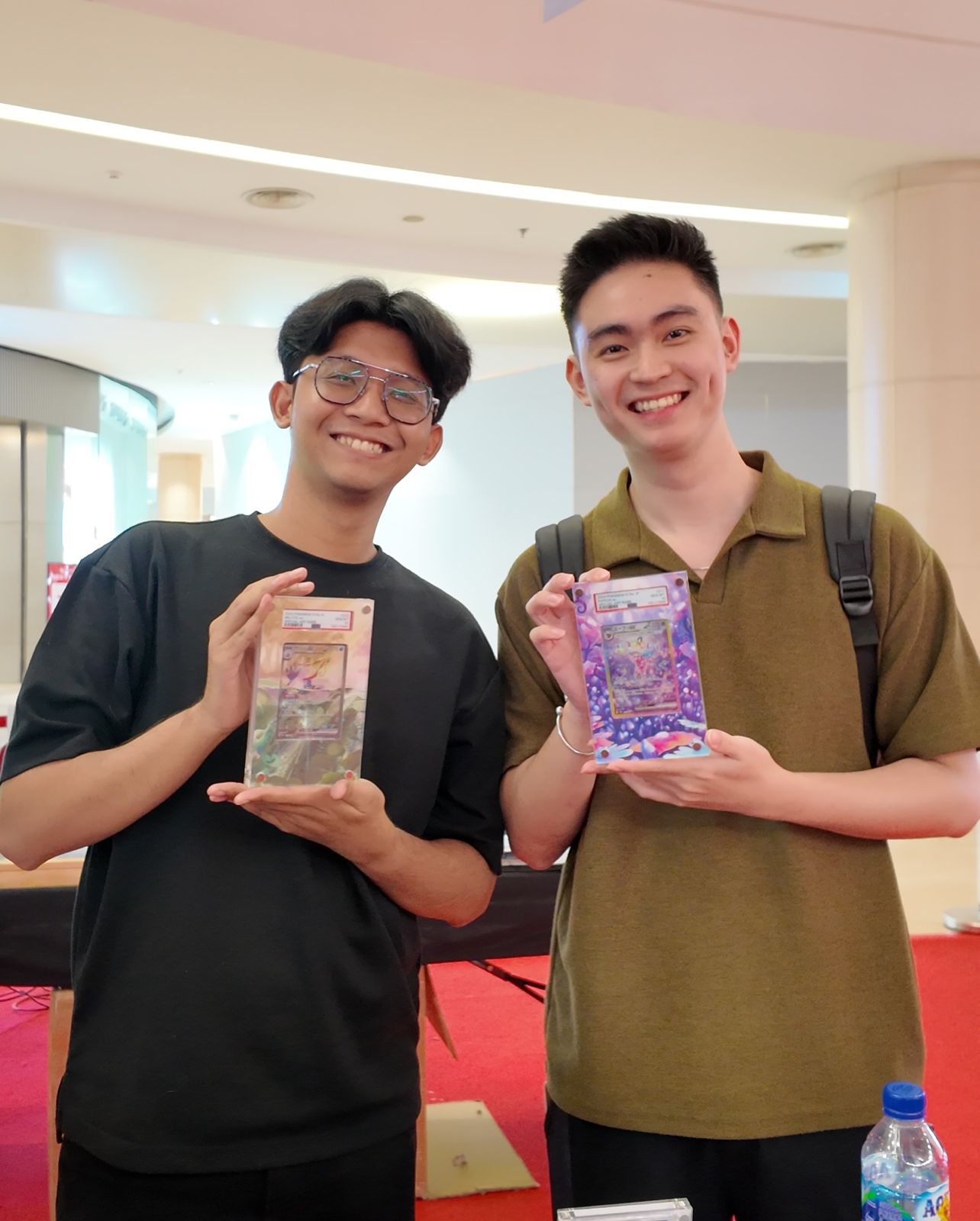 Collector holding a Legacy Vault extended art case out in the city